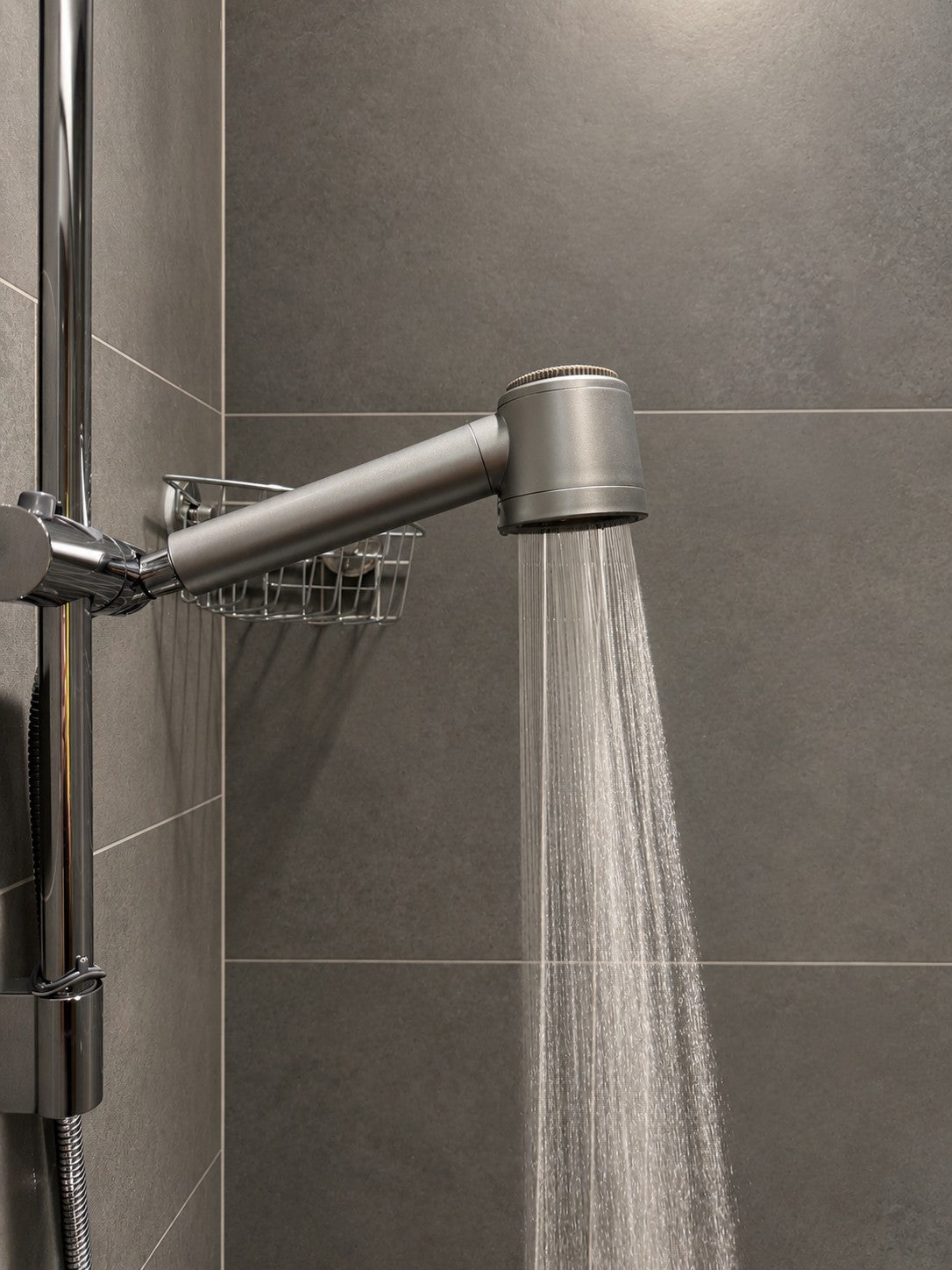 Modern shower head with water running in a bathroom